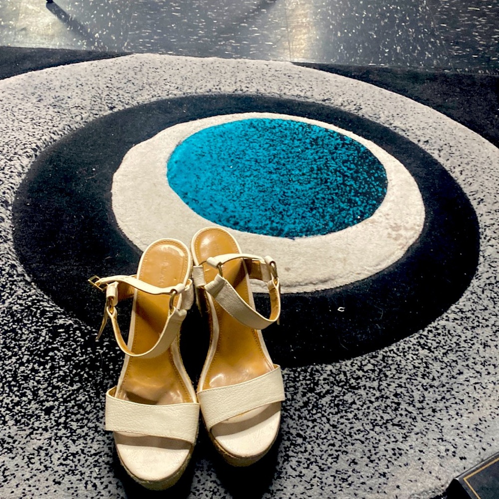 White tie out sandal with gold buckle and linen sides.